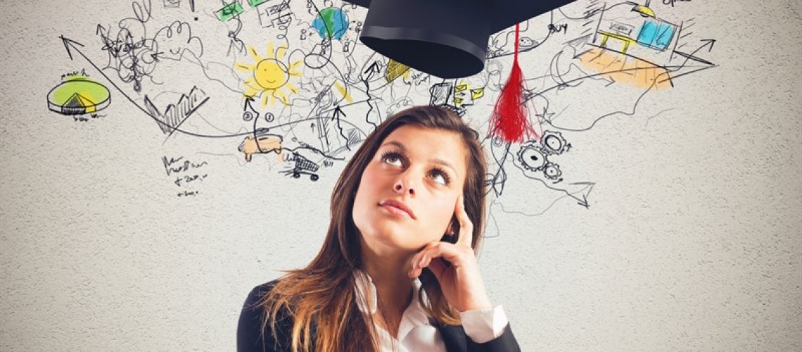 Woman with graduation cap and plan sketch